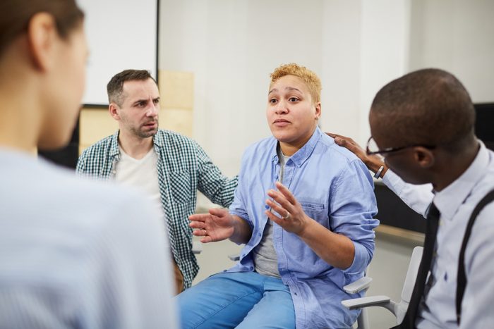 Portrait Of Mixed Raced Woman Sharing Troubles Emotionally Duri