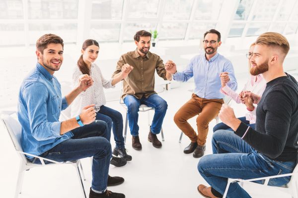 gooden-center-mental-health-treatment-photo-of-Happy-smiling-people-holding-hands