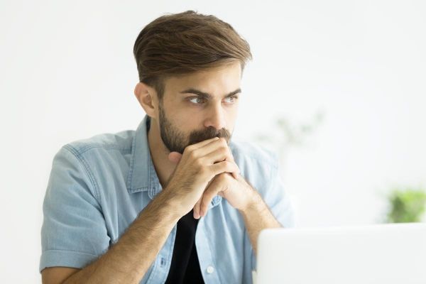 goodcenter-OCD-and-the-Drive-for-Success---Is-Residential-Treatment-the-Answer-photo-of-Thoughtful-serious-young-man-lost-in-thoughts