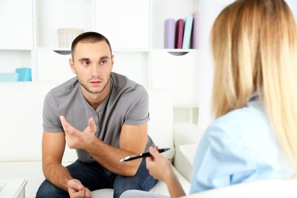 goodencenter-the-connection-between-mental-illness-and-substance-abuse-photo-of-a-Young-man-on-reception-at-psychologist