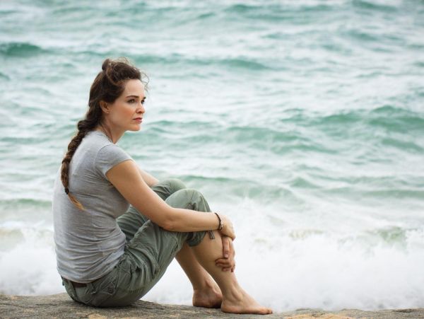 goodencenter-women's-Mental-Health-Treatment-photo-of-Closeup-of-A-sad-and-pensive-woman-sitting-by-the-ocean-deep-in-thought