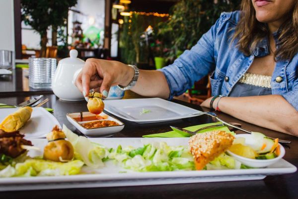 goodencenter-Nutrition-and-Mental-Health-photo-of-a-woman-eating-healthy-foods