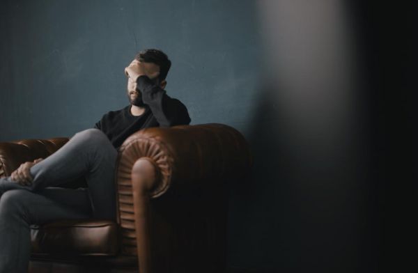 goodencenter-How-Do-I-Know-If-I-Am-Bipolar-photo-of-a-depressed-man-sitting-on-a-chair