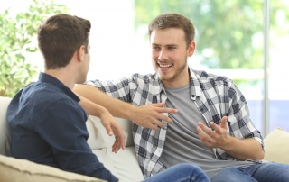 Gooden Center 12 Cool Inspirational Quotes for Your Recovery photo of Two friends talking sitting in a couch in the living room