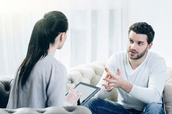 goodencenter Seasonal Affective Disorder Symptoms Diagnosis Treatment photo of a psychologist sitting opposite her patient 