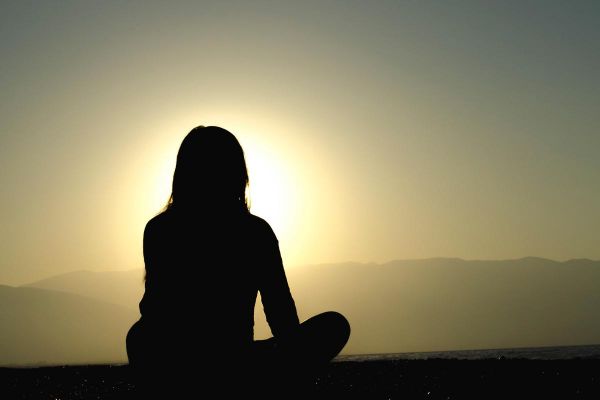 goodcenter Can Mindfulness Help Me Recover from Opioid Addictio photo of a woman meditating near the ocean