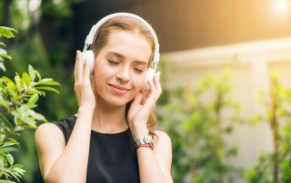 beautiful woman listening to music using it as a therapy for mental health