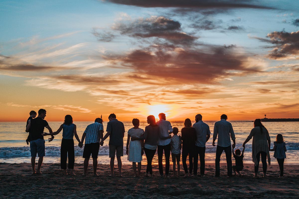 photo of family on the beach during sunset Rebuild Ties Early in Sobriety